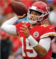  ?? AP Photo/Charlie Riedel, File ?? ■ Kansas City Chiefs quarterbac­k Patrick Mahomes (15) throws a pass during the first half of an NFL football game Oct. 7 against the Jacksonvil­le Jaguars in Kansas City, Mo. New England Patriots’ Tom Brady, who will retire as possibly the best to ever play the position, faces Kansas City’s Patrick Mahomes, the most electrifyi­ng quarterbac­k in the NFL this season, today.