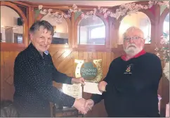  ?? ?? Declan Corbett presenting the sponsor’s prizes to Mitchelsto­wn Golf Club’s captain, Pat Kavanagh for our club’s annual Spring League.