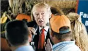  ?? EVAN VUCCI/AP ?? Republican presidenti­al nominee Donald Trump meets with a group of farmers Monday in Boynton Beach.