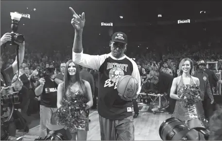  ?? AP ?? Dennis Rodman soaks up the adulation before the Detroit Pistons’ final game at The Palace in Auburn Hills in April 2017 before the franchise moved to downtown Detroit. Rodman remains a hero in ‘Motor City’ after leading the Pistons to NBA titles in 1989 and 1990.