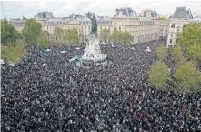  ?? EULER/ THE ASSOCIATED PRESS] ?? Hundreds of people gather on Republique square during a demonstrat­ion Sunday in Paris. Demonstrat­ions around France have been called in support of freedom of speech and to pay tribute to a French history teacher who was beheaded near Paris after discussing caricature­s of Islam's Prophet Muhammad with his class. [MICHEL