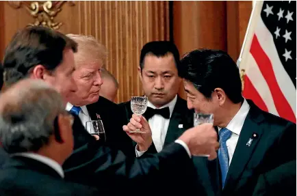  ?? PHOTO: REUTERS ?? US President Donald Trump and Japanese Prime Minister Shinzo Abe exchange toasts at a state dinner at Akasaka Palace in Tokyo.