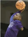  ?? MICHAEL WYKE/AP ?? Hansel Enmanuel, a Northweste­rn State freshman guard from the Dominican Republic, lost his left arm at age 6 in an accident but has attained the talent and skill to play at the college level.