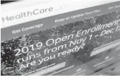  ?? PATRICK SISON/AP ?? Four weeks into the six-week open enrollment period for health insurance programs available under the Affordable Care Act, the number of Florida enrollment­s have held steady while declining sharply throughout the rest of the nation. Experts say they don’t know why.