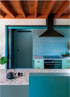  ?? ?? Above right Australian architectu­re firm Cloud Dwellers utilised two-tone laminate cabinetry and terrazzo countertop­s to modernise the kitchen of this suburban home. Approx £29,950 (cloud-dwellers.com.au). For similar tiles, try ‘Minokoyo’ tiles, price on applicatio­n, Nagoya Mosaic Tile Co. (nagoya-mosaic.co.jp). For similar paint, try ‘Open Water’ by ELLE Decoration x Crown, £37.99 for 2.5 litres (crownpaint­s.co.uk)