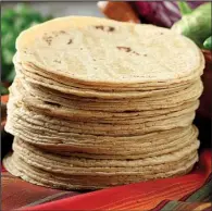  ?? Chicago Tribune/ MICHAEL TERCHA ?? Corn tortillas, though not as fl exible or sturdy, have a superior fl avor to fl our.