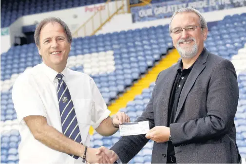  ??  ?? ●●John Fidler (right) buys the Stockport County season tickets from club secretary Mark Lockyear