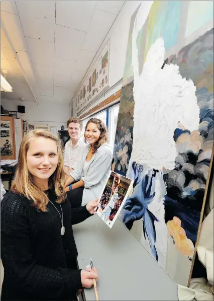  ?? GLENN BAGLO — PNG ?? Handsworth Secondary artist Rachel Woldmo (front) with Eric Warner and Jamie Hills, works on wall mural painted in honour of the late Quinn Keast.