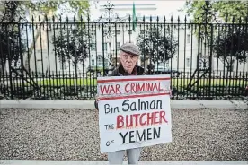  ?? JACK TAYLOR GETTY IMAGES ?? A protester demonstrat­es against the war in Yemen and the killing of journalist Jamal Khashoggi.