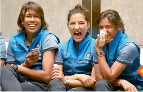  ?? PTI ?? LAST LAUGH: Jhulan Goswami (from left), Sushma Verma and Harmanpree­t Kaur share a light moment during a press conference in Mumbai on Wednesday.