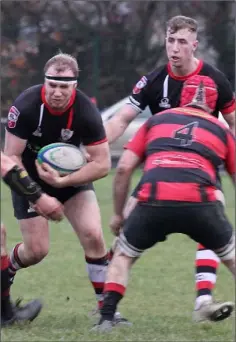  ??  ?? Timmy Morrissey gaining some hard yards for Enniscorth­y.