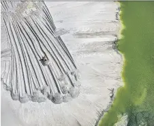  ?? EDWARD BURTYNSKY/NICHOLAS METIVIER GALLERY ?? Anthropoce­ne: The Human Epoch is a scary look at how humanity is altering the planet. One scene show a phosphor tailings pond near Lakeland, Fla.