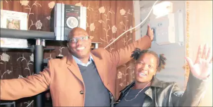  ??  ?? HAPPINESS: Dimakatso Nkubeni, an Ivory Park resident, celebrates with executive mayor Mangaliso Matika after he officially switched on the electricit­y in the area yesterday.
Picture: Soraya Crowie