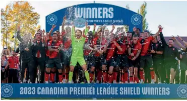  ?? Credit: Cavalry FC ?? Shield holders…Cavalry players lift the 2023 CPL Shield after topping the regular season league table