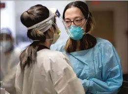  ?? DR. MARWA KILANI, ?? right, with a nurse, is the medical director for palliative care at the Mission Hills facility. She guides the Harrises on Bob’s wishes.