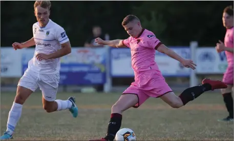  ??  ?? Mark Slater of Wexford F.C. on the ball as Greg Sloggett (U.C.D.) closes him down.