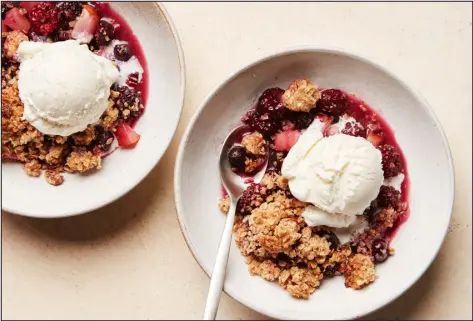  ?? PHOTOS BY JOSEPH DE LEO — THE NEW YORK TIMES ?? Whether you throw in a little more fruit or skimp a little on the nuts, you’re going to end up with a vibrant yet warm dessert of jammy fruit and crunchy crumble.