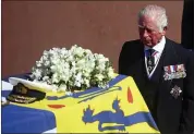  ?? HANNAH MCKAY-ASSOCIATED PRESS ?? Prince Charles follows the coffin of his father Britain’s Prince Philip during the funeral inside Windsor Castle in Windsor, England, Saturday, .