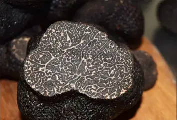  ?? Cavan Patterson ?? Cavan Patterson of Wild Purveyors is offering Perigord truffles from Australia at his warehouse in East Liberty. Known as the Black Diamond, the black winter fungi is revered for its earthy aroma and decadent flavor.