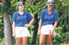  ?? [PHOTO BY MATT BARNARD, TULSA WORLD] ?? Trudy Allen, from Union, left, and Taylor Dobson, from Broken Arrow, have a laugh between holes Monday as they play in an All-State golf match at the Cherokee Hills Golf Club in Catoosa.