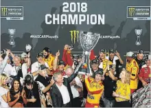  ?? SEAN GARDNER GETTY IMAGES ?? Joey Logano won the season finale Sunday at Homestead-Miami Speedway to win his first Cup championsh­ip and Ford’s first since 2004.