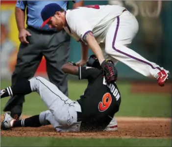  ?? LAURENCE KESTERSON — THE ASSOCIATED PRESS ?? The Marlins’ Dee Gordon (9) is tagged out at first on a rundown by Phillies starting pitcher Alec Asher in the third inning Sunday in Philadelph­ia.