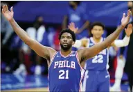  ?? MATT SLOCUM — THE ASSOCIATED PRESS ?? The 76ers’ Joel Embiid reacts after a basket during the second half against the Bulls, Friday.