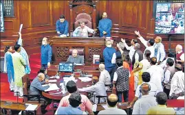  ?? ANI ?? Opposition MPs in the Well of the Upper House during the monsoon session on Monday.