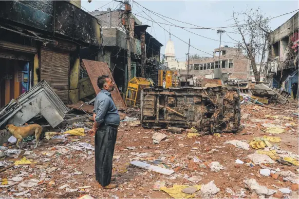  ?? AFP ?? The aftermath yesterday of three days of rioting between Muslims and Hindus in New Delhi. The government has banned public assembly in some areas