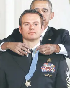  ??  ?? Obama presents the Medal of Honour to Byers during a ceremony in the East Room of the White House in Washington. — Reuters photo