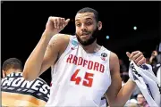  ?? AP/JOHN MINCHILLO ?? Radford’s Darius Bolstad celebrates in the final moments of the victory over LIU Brooklyn in the NCAA Tournament on Tuesday night. Radford advances to face top-seeded Villanova on Thursday.