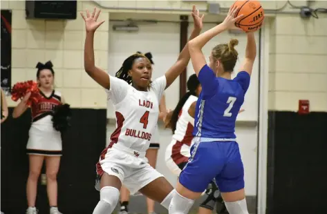  ?? (Pine Bluff Commercial/I.C. Murrell) ?? Kenedi Bowman of White Hall guards Jade Steele of Greenbrier in the second half Friday in White Hall.