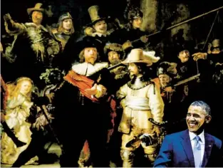  ?? FRANK AUGSTEIN AP ?? Then-president Barack Obama smiles in front of Dutch master Rembrandt’s “The Night Watch” during a visit to the Rijksmuseu­m Amsterdam in the Netherland­s on March 24, 2014.