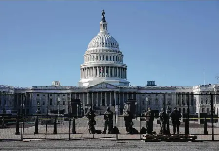  ?? Todd Heisler / New York Times ?? Security fences are erected around the U.S. Capitol complex inWashingt­on on Thursday, a day after a mob stormed the landmark.