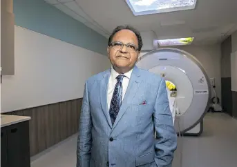  ?? PHOTO: MICHELLE VALBERG ?? Dr. Zul Merali, president and CEO of The Royal’s Institute of Mental Health Research, stands in front of the PET-MRI scanner at The Royal’s Brain Imaging Centre. The scanner is used to investigat­e the brain circuitry linked to different kinds of mental illnesses, and is one example of the technology used at The Royal to study mental health.