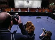  ?? ANDREW HARNIK — THE ASSOCIATED PRESS ?? From left, Sen. John Thune, R-S.D., Labor Secretary Eugene Scalia, Senate Majority Leader Mitch McConnell of Ky., Treasury Secretary Steven Mnuchin, Senate Minority Leader Sen. Chuck Schumer of N.Y., White House chief economic adviser Larry Kudlow, and others, attend a meeting to discuss the coronaviru­s relief bill on Capitol Hill, on Friday.