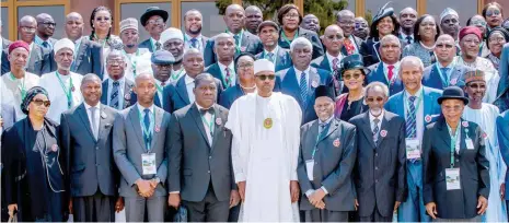  ?? Photo: NAN ?? President Muhammadu Buhari (middle); Chief Justice of Nigeria, Justice Tanko Muhammad (5th right) Chairman, Senate Committee on Judiciary, Sen. Michael Bamidele (4th left); FCT Minister, Muhammad Musa Bello (right) with judges and other participan­ts, during the 2019 All Nigeria Judges Conference at the National Judicial Institute in Abuja yesterday