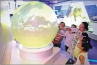  ?? JIANG SHENG / FOR CHINA DAILY ?? Children visit the Ye Duzheng Meteorolog­ical Science and Technology Populariza­tion Exhibition Hall in Anqing, Anhui province, on Saturday.