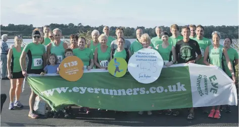  ?? Eye Community Runners certainly do their bit for charity. Here members are pictured donating £425 to the Sue Ryder Thorpe Hall following their recent 5k handicap competitio­n in which 88 local runners took part. Chris Rowe was the first runner home for the ??