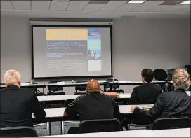  ?? TYLER ESTEP/TYLER.ESTEP@AJC.COM ?? Members of the Gwinnett County ethics board watch a video on the county’s ethics ordinance. Commission­ers voted Tuesday to update the ordinance.