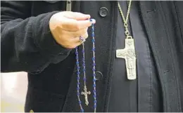  ?? ?? Auxiliary Bishop Ramon Bejarano led a group in saying the rosary as part of the annual event on Saturday.