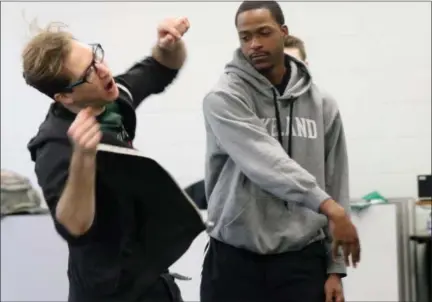  ?? JONATHAN TRESSLER — THE NEWS-HERALD ?? Ohio Shakespear­e Festival crew member Ryan Zarecki, left, reacts to being “pushed” by Lakeland Community College student and Mayfield Heights resident James Bennett during one of the Shakespear­e Stage Combat workshops offered at Lakeland April 4.