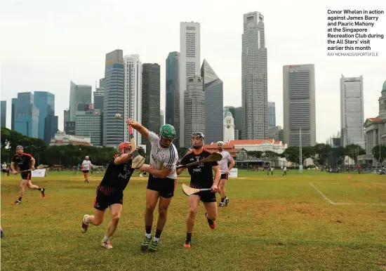  ?? RAY MCMANUS/SPORTSFILE ?? Conor Whelan in action against James Barry and Pauric Mahony at the Singapore Recreation Club during the All Stars’ visit earlier this month