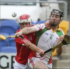  ??  ?? Glenealy’s Michael Byrne and Kiltegan’s Ciaran Doyle battle for the ball.