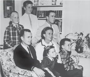  ?? AP ?? George H.W. Bush with his wife, Barbara, and Dorothy and Marvin in 1964. Back, from left, Neil, Jeb and George W. Bush.