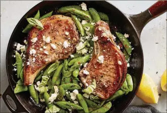  ?? BY REBECCA JURKEVICH; PHOTOS BY JOHNNY MILLER/THE NEW YORK TIMES ?? One pan pork chops with feta, snap peas, and mint, on May 21, 2019. FOOD STYLED