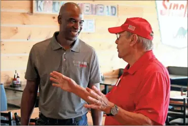  ?? Jeremy Stewart ?? U.S. Senate candidate Kelvin King (left) talks with Polk County Republican Party 2nd Vice Chair Ken Suffridge while in Rockmart on Saturday, Aug. 7.