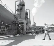  ?? MARCIO JOSE SANCHEZ/AP 2021 ?? Derek Benson, COO of EnergySour­ce Minerals, walks through a plant in Calipatria, California, where the company is extracting lithium from brine.