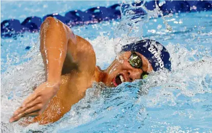  ??  ?? Big splash: Welson Sim beat Olympic champion Mack Horton en route to the 400m silver medal in a new national record time of 3:49.29 at the New South Wales championsh­ips yesterday.