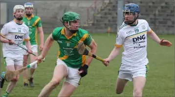  ??  ?? Daniel Martin Carroll of Rathgarogu­e-Cushinstow­n taking on HWH-Bunclody’s Cathal Dunbar.